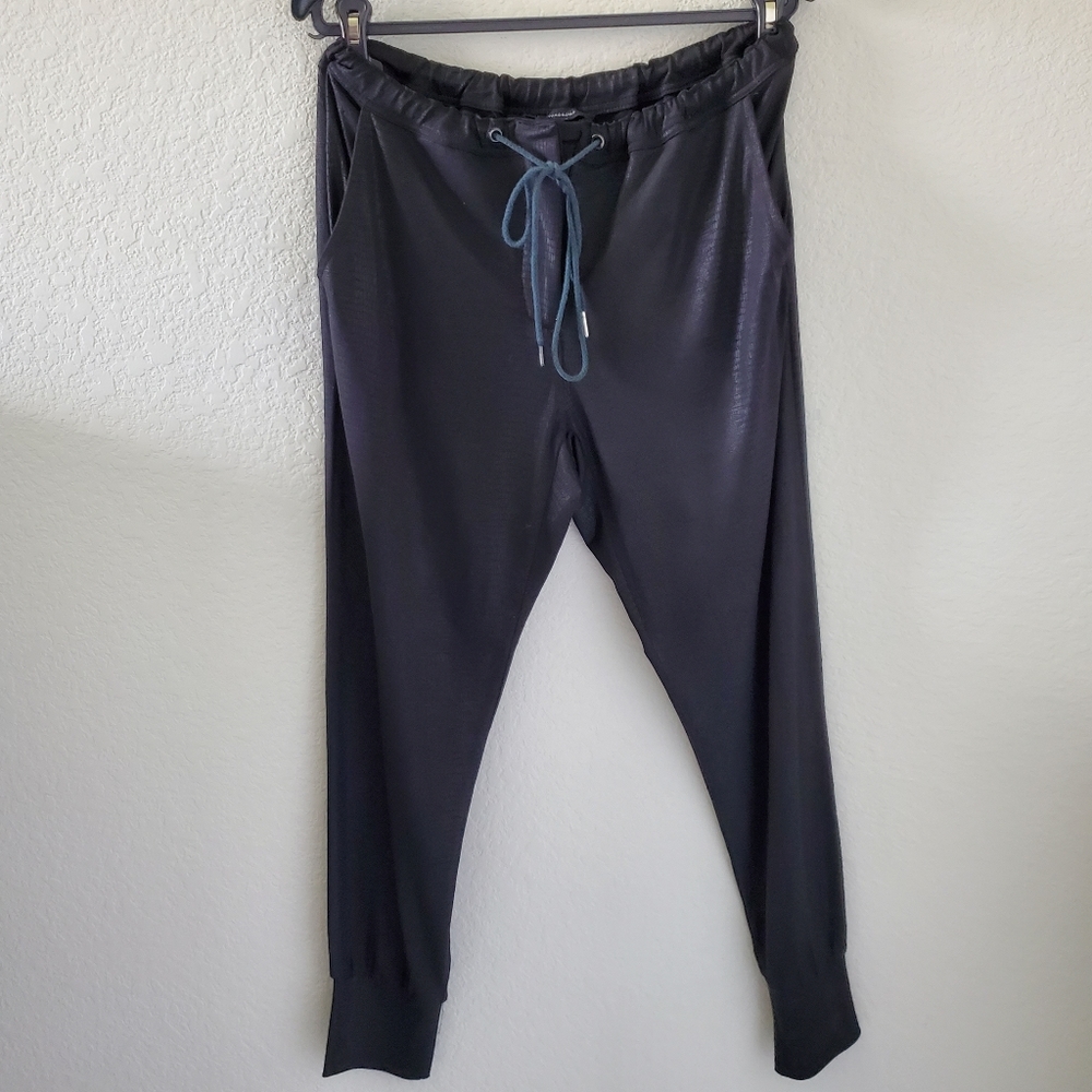 Olivaceous snake print embossed casual jogger style pants